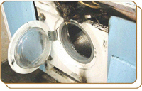 Accumulated water seeped into a washing machine, causing current leakage and fire