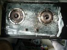 Broken glass panel of built-in gas hob