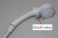 Don't install a shower head with an on-off control valve on a "shower storage type" electric water heater
